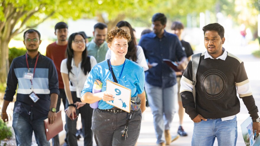 A group of international students walking on the Missouri State University campus.