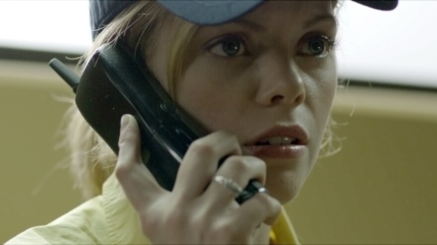 Fast-food employee Becky (Dreama Walker) finds herself the victim of a cruel "prank call" scam in <em>Compliance</em>.