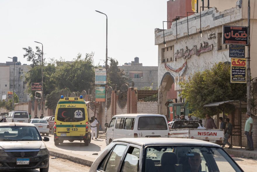 An ambulance with a patient from the Gaza Strip drives toward El Arish General Hospital in El Arish, Egypt.