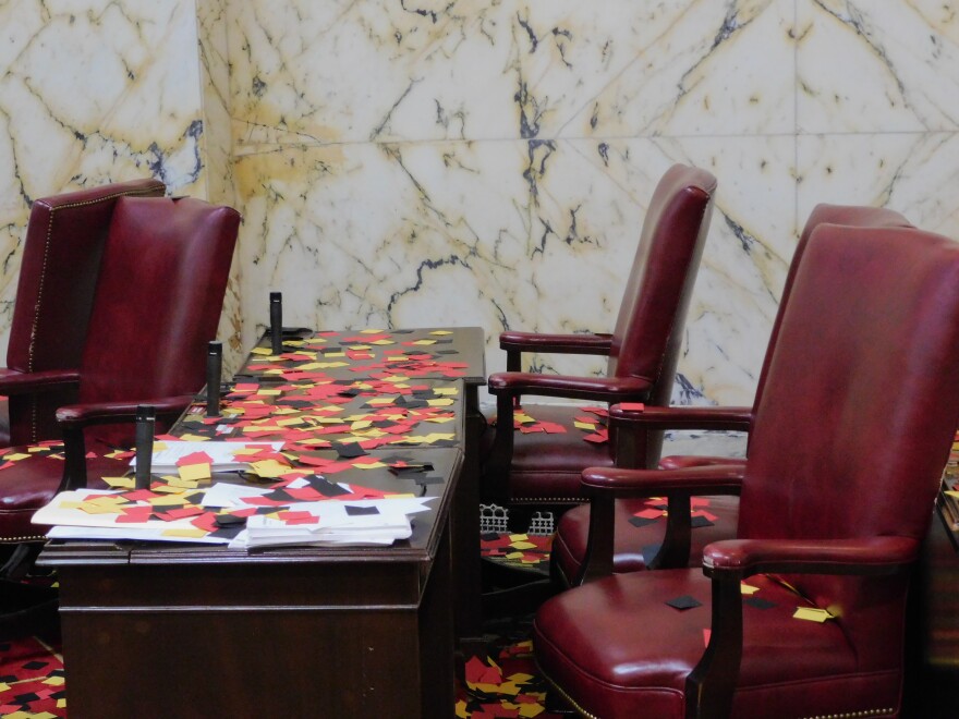 Confetti graces the empty chairs and desks of senators following the adjournment of the 2026 legislative session on Monday in the Senate chamber in Annapolis, Md.