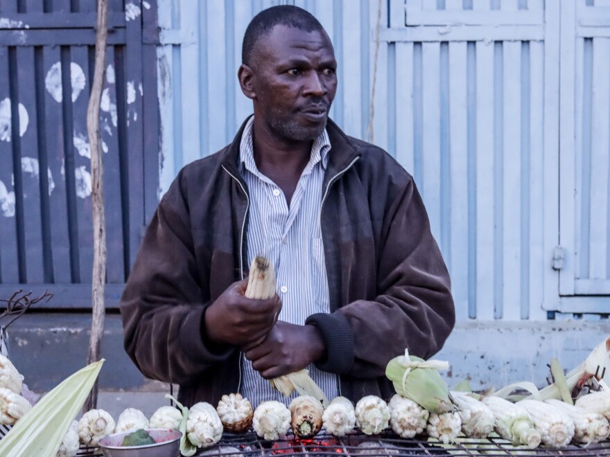 Stanley Ngugi buys supplies of maize to sell in Kibera. During the pandemic, his income dried up. "There were many of us who slept hungry and with zero support from the government then," he recalls.