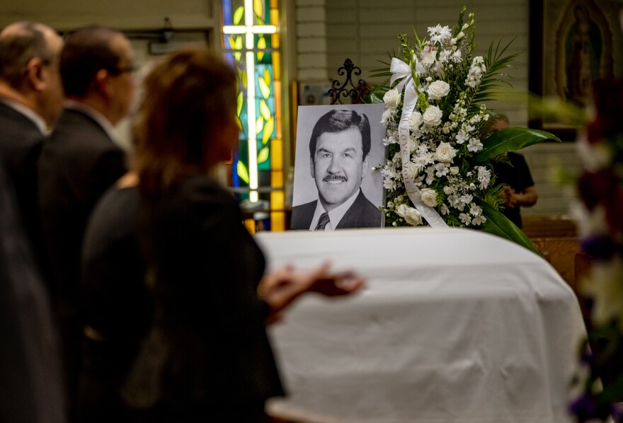 Family members pray during the funeral service for Ernest Robles, founder of the National Hispanic Scholarship Fund, at Holy Name of Jesus Church on Sept. 26 in Redlands, Calif.