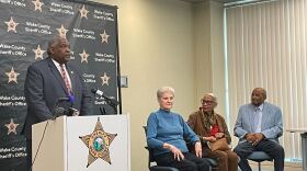 Wake County Sheriff Willie Rowe talks about new Well Check Program. Three senior citizens standby waiting to be interviewed.