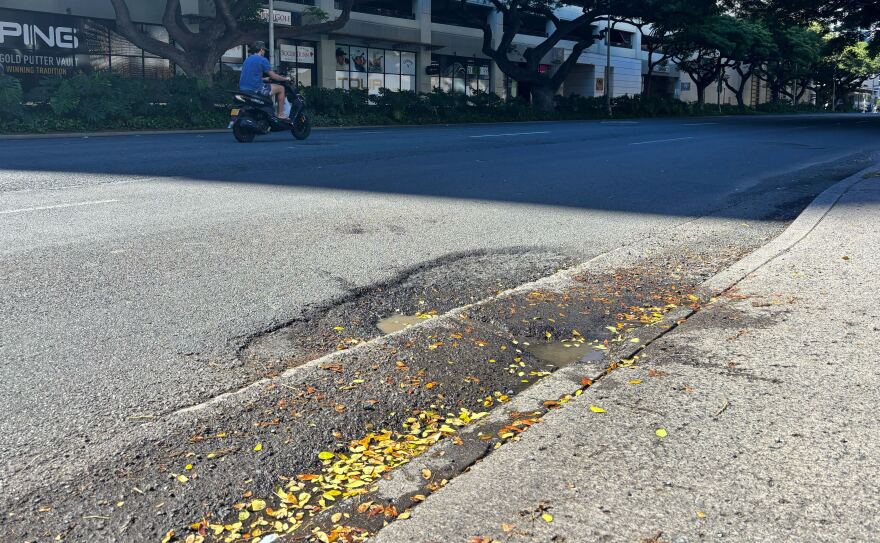 A pothole on the edge of Kapiʻolani Boulevard in Honolulu on Dec. 2, 2025.