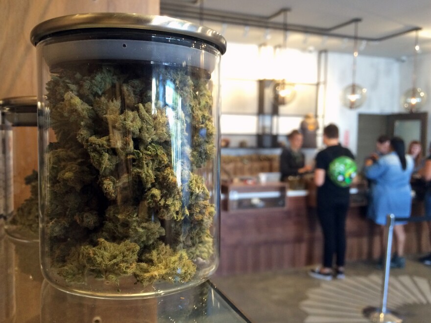 Customers buy products at the Harvest Medical Marijuana Dispensary in San Francisco in 2016. Illinois has joined California and nine other states in legalizing the recreational use of the drug.