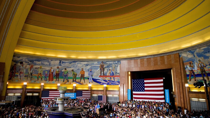 Democratic presidential candidate Hillary Clinton, accompanied by Sen. Elizabeth Warren, speaks at the Cincinnati Museum Center at Union Terminal on Monday.