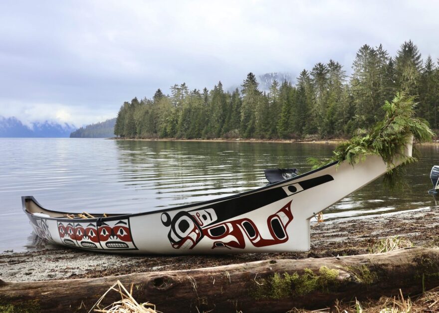 Petersburg’s kéet yaakw (killer whale canoe) rests on the shore of Sandy Beach Park on April 19, 2026. Xájoosa John Garcia III painted the formline design showing a killer whale transformation, reminiscent of Tlingit creation stories.