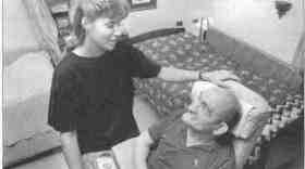 Care worker Patty Bradburn works with a resident of the Lincoln Developmental Center.