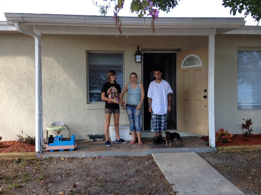 Willow and her tenants, in front of the house Willow bought with her mother.