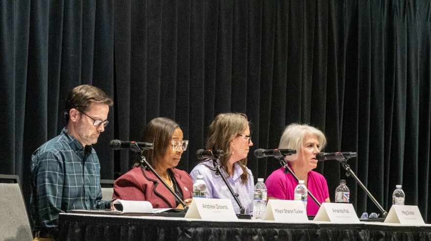 Fort Wayne city officials, including Mayor Sharon Tucker (2nd from left) address the crowd at a public hearing for the proposed Anchor Resource Center. The low-barrier shelter would offer services to the city's unhoused population.