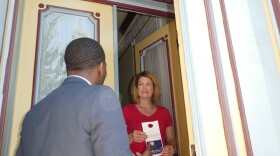 Marty Murray, a candidate for 7th Ward committeeman, talks to Stacy Kistler while knocking doors in the Lafayette Square neighborhood of St. Louis on June 10, 2016.