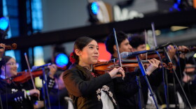 Brenda Guzman performs with other University of Nevada, Las Vegas mariachi students at a football game Saturday, Oct. 3, 2026, in Las Vegas. (AP Photo/John Locher)