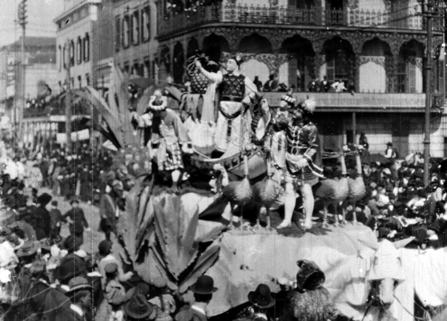 A still photograph of the 1898 film, Mardi Gras Carnival, shows the Krewe of Rex rolling through New Orleans