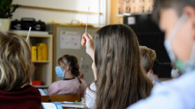 Pupils wearing face masks get ready to proceed to a coronavirus rapid test at the start of a lesson at an elementary school in Berlin after coming back from summer holidays and amid the coronavirus COVID-19 pandemic.