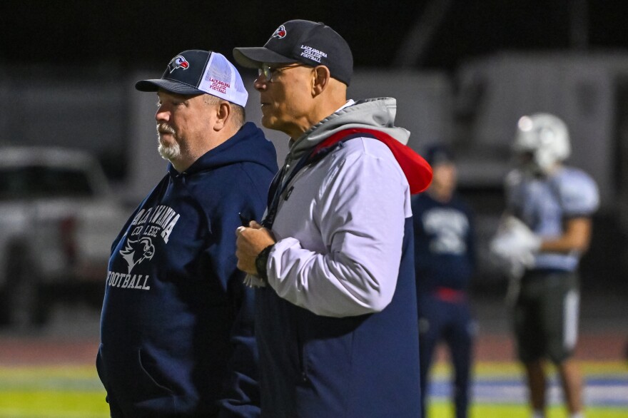 Assistant Coach Paul Wiedlich and Lackawanna College Head Football Coach Mark Duda watch plays during practice.