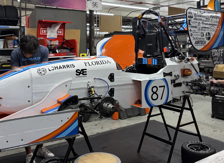 Gator Motorsports members testing ideas on last year's Formula-style race car in the team’s shop at the University of Florida.