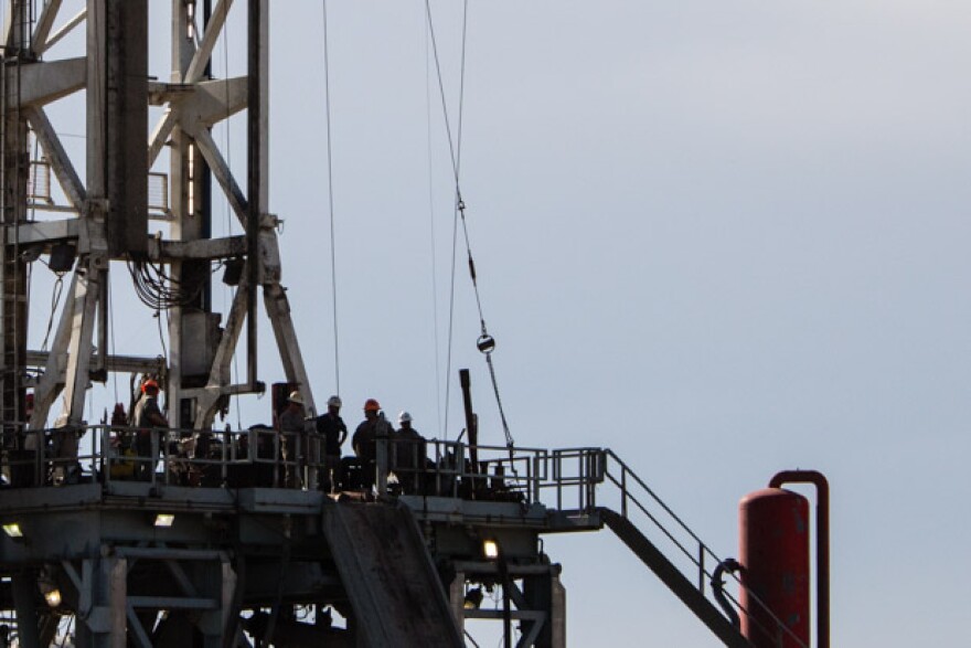 Workers assemble a horizontal drilling rig in southwestern Oklahoma's Grady County, near a booming oil play known as the SCOOP.