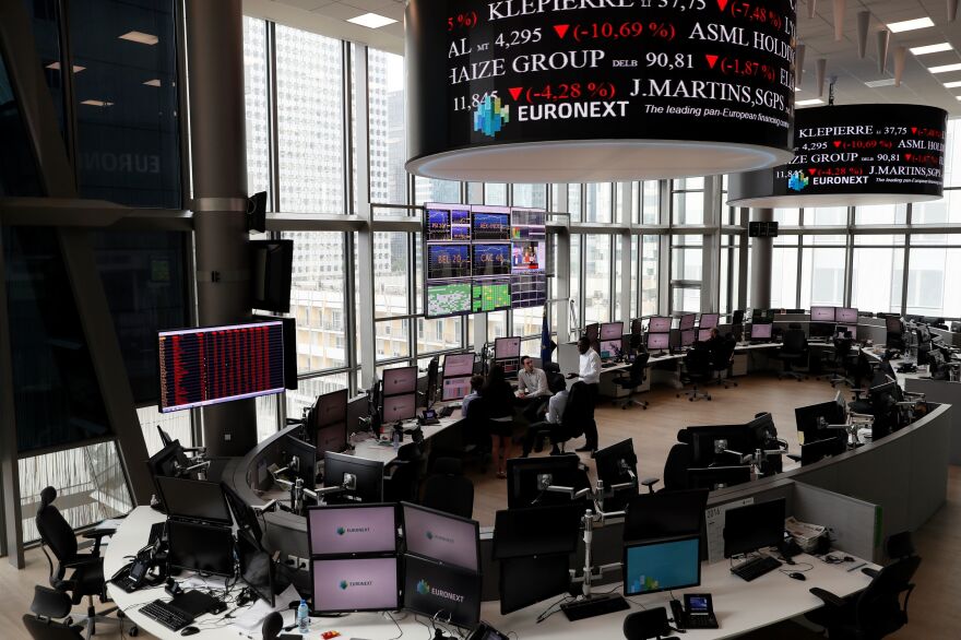 Screens show plunging stocks at the Euronext Stock Exchange services in Paris on Friday, as Britain votes to leave the European Union, fueling a wave of global uncertainty.