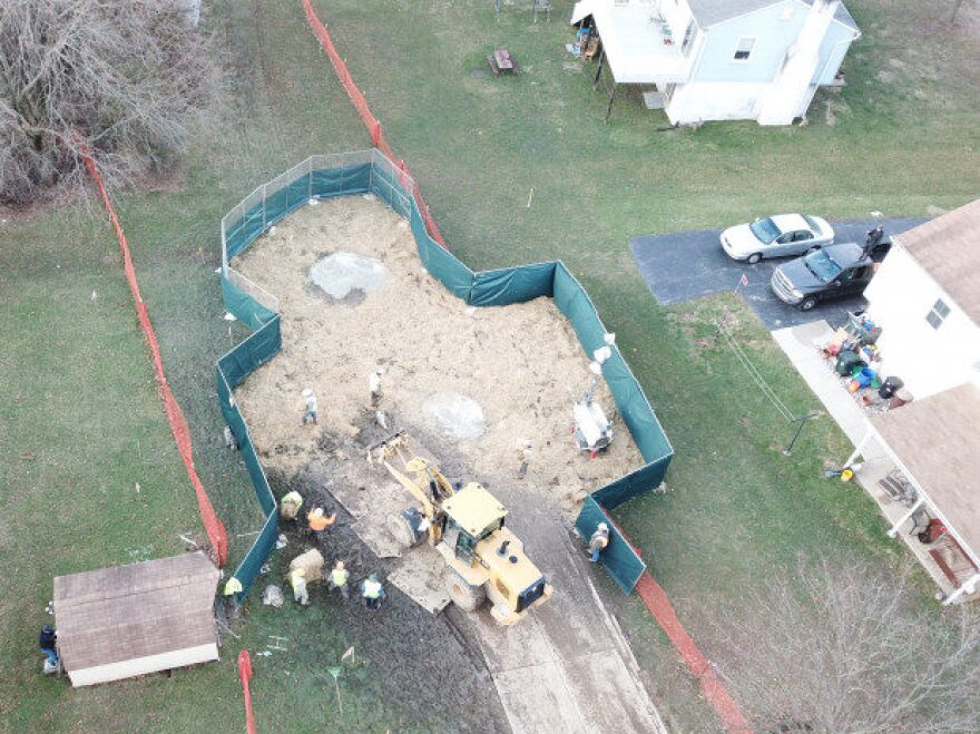 ERIC FRIEDMAN Crews work to stabilize sinkholes in a West Whiteland Township neighborhood on March 3. The sinkholes appeared recently near a construction site for the Mariner East 2 pipeline.