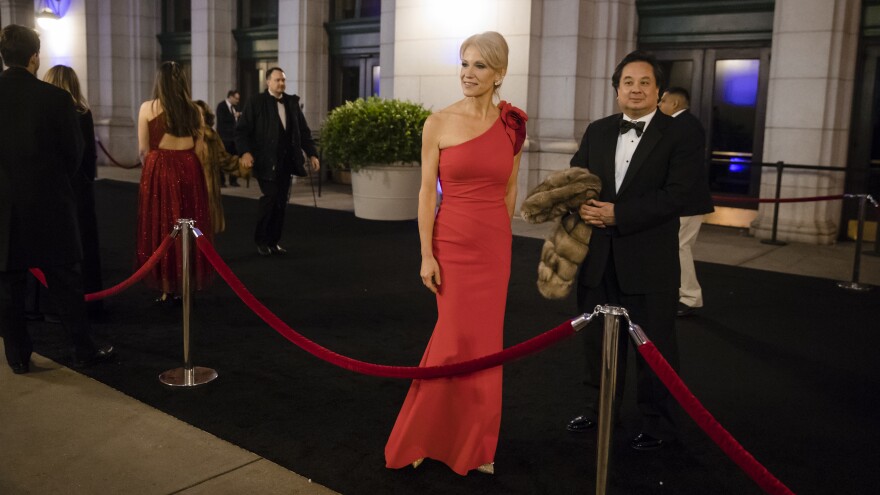 Kellyanne Conway, accompanied by her husband, George, arrives for a dinner at Union Station in Washington, D.C., on Jan. 19, 2017, the day before Donald Trump's inauguration.