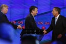 Ted Cruz (center) and John Kasich shake hands while Donald Trump looks on following the CNN Republican presidential debate last month.