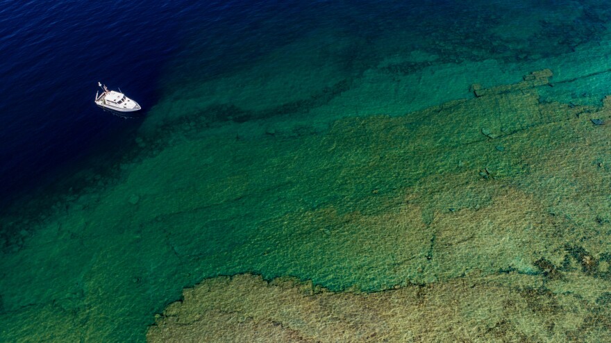 A boat in Lake Huron near a sinkhole in Alpena, Michigan