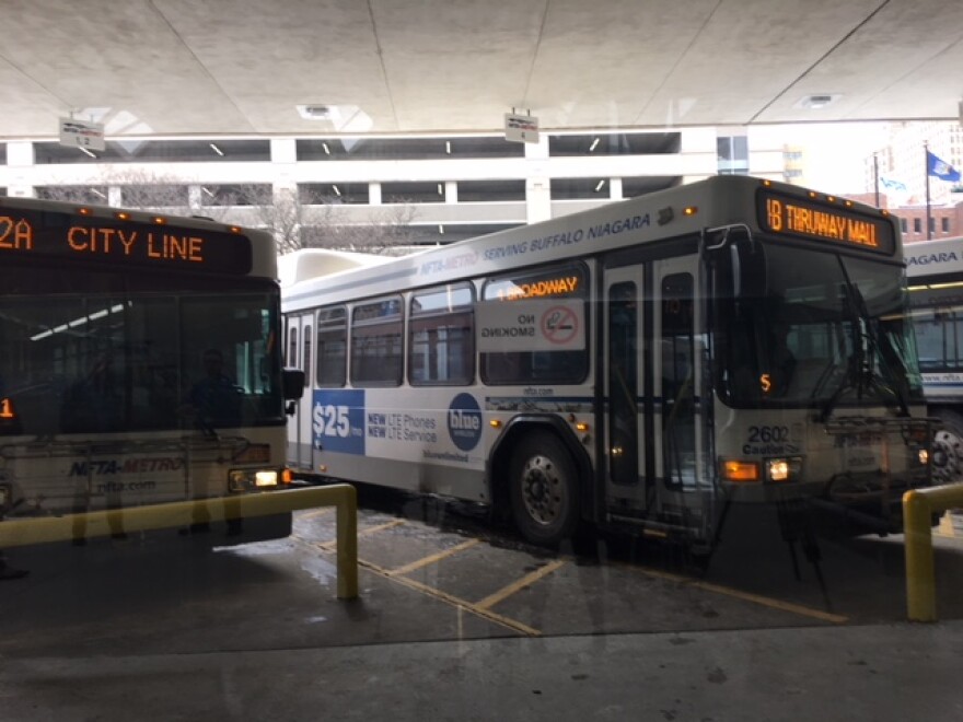 Two parked Metro buses.