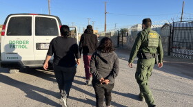 Border Patrol agent takes three people into custody in El Paso.