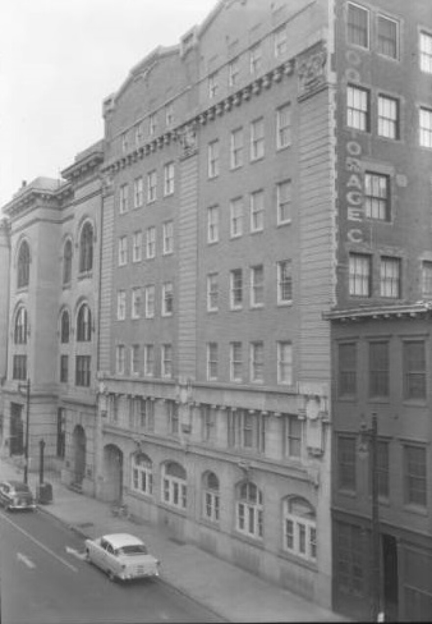 The former Courier-Journal building, now the Landmark Building, at the corner of Liberty Street and Third Street in a row of other buildings.