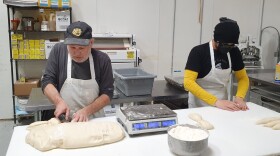 Brett and Kaylan portion the pretzel dough into 0.42 of a pound