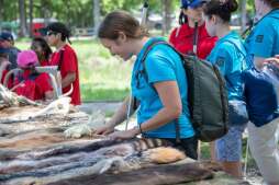 Blind Outdoor Learning & Development (BOLD) event at Palmetto State Park introduces blind chilrdren to the outdoors. Touch table with animal pelts and 3D renderings of Goliad missions