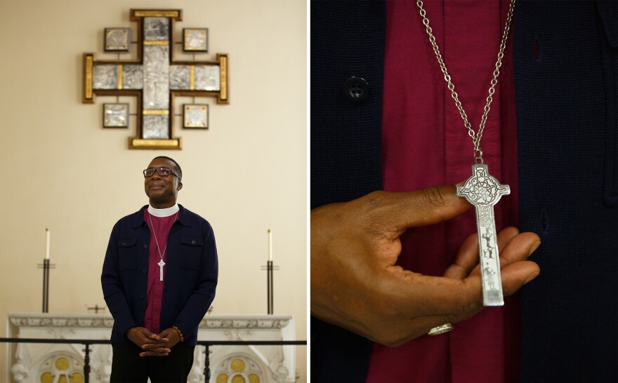 Bishop Deon Johnson holds his cross necklace in Christ Church Cathedral in St. Louis' Downtown West neighborhood.