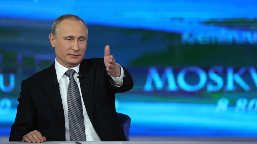 Russian President Vladimir Putin gestures while answering a question during his annual televised call-in show in central Moscow on Thursday.