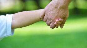 grandparent holding hands