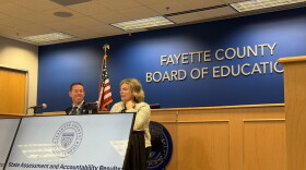 Fayette County Public Schools Interim Superintendent Dr. Bill Bradford, left, and Director of Assessment Dr. Brooke Stinson, right, present an overview of 2025-26 state performance test scores during a news briefing at the John D. Price Administration Building Oct. 14, 2026.