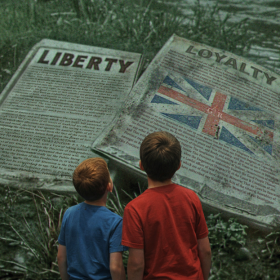 Young men choose which side they would have fought on at the Carolina Rising Museum in