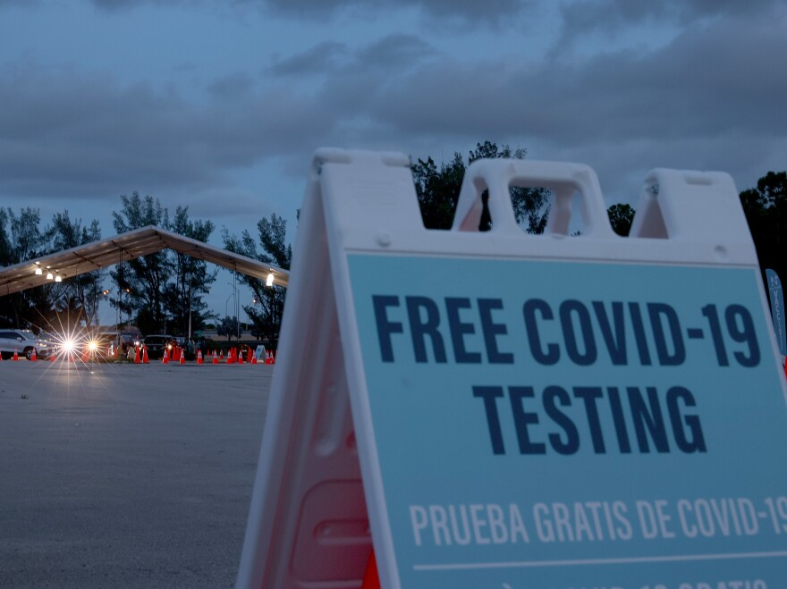 Coronavirus tests are administered at a 24-hour drive-through site set up by Miami-Dade County, Fla., and Nomi Health in August. Some workers will have the option of getting weekly coronavirus tests instead of being vaccinated.