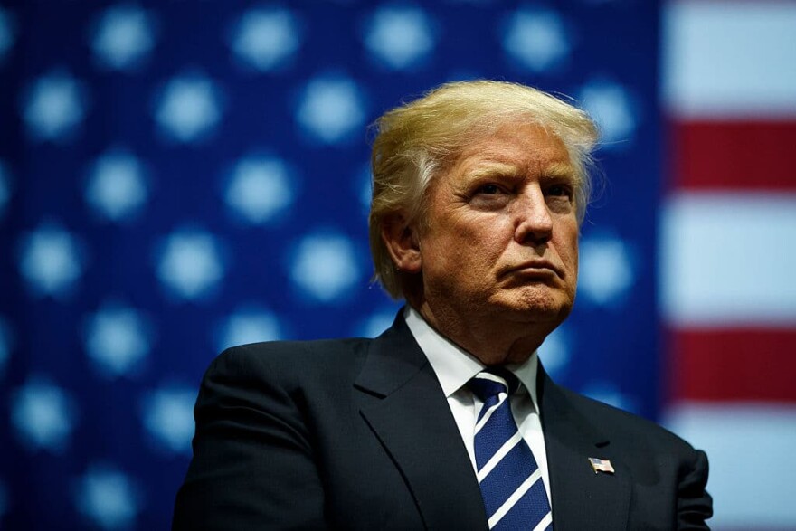 President-elect Donald Trump looks on during a rally at the DeltaPlex Arena, December 9, 2016 in Grand Rapids, Michigan. (Photo by Drew Angerer/Getty Images)