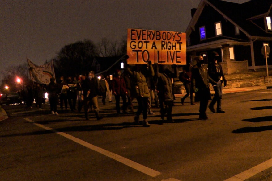 People marched through the streets of Bloomington's neighborhoods chanting and singing.