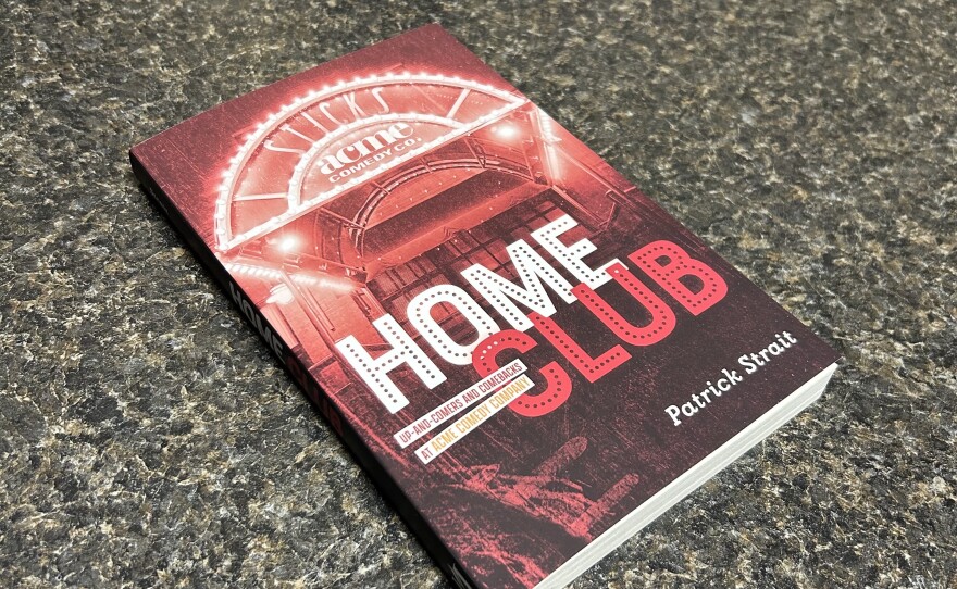 A red book with the title "Home Club" on a countertop.