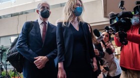 Elizabeth Holmes, the founder and former CEO of blood testing and life sciences company Theranos, arrives for the first day of jury selection in her fraud trial (Nick Otto/ Getty Images)