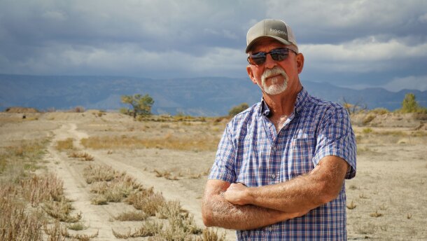 Carbon County farmer Kevin Cotner stands next to a bare field south of Price, Sept. 30, 2025. He’s one of around a dozen Utah farmers who are leaving some of their land unplanted and unirrigated this year as part of a state effort to leave more water for the Colorado River.