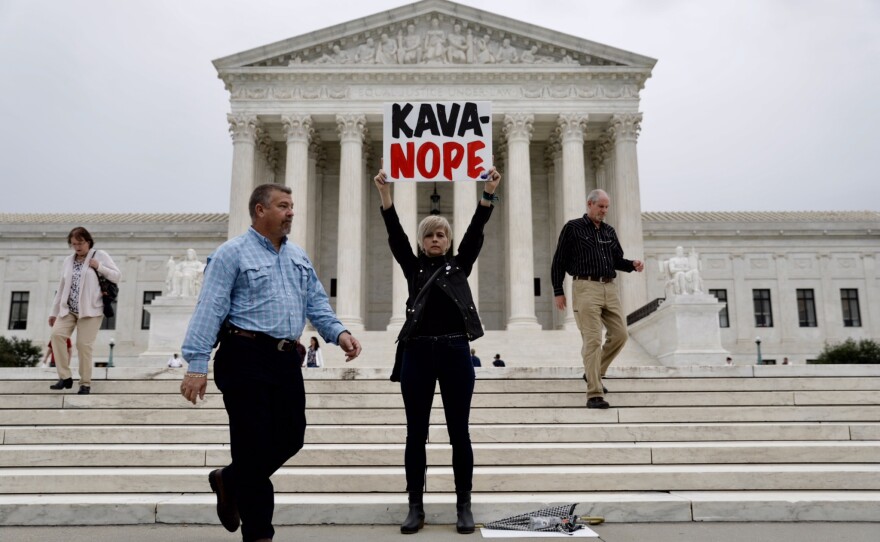 Outside the Supreme Court, people gathered Thursday morning to protest Kavanaugh's nomination.