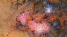 This image provided by the NSF-DOE Vera C. Rubin Observatory shows 678 separate images taken by the observatory in just over seven hours of observing time. Combining many images in this way clearly reveals otherwise faint or invisible details, such as the clouds of gas and dust that comprise the Trifid nebula (top right) and the Lagoon nebula, which are several thousand light-years away from Earth. (NSF-DOE Vera C. Rubin Observatory via AP)