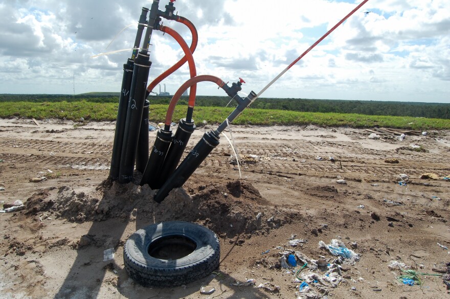 Buried within the Orange County Landfill are some 500 wells, which capture methane before it is emitted to the atmosphere. The Stanton Energy Center is visible in the distance.