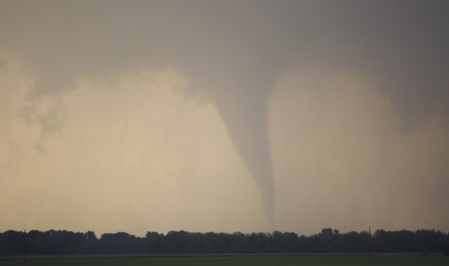 A tornado forms and touches down north of Soloman, Kansas, Saturday, April 14, 2012.