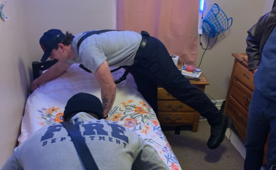 Allen Joines assembles bed with police 