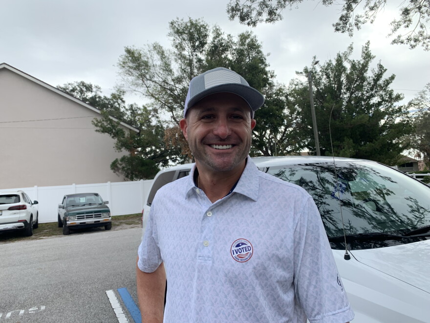 Man wearing a cap and and I Voted sticker