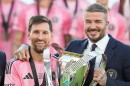 David Beckham poses with the MLS Cup trophy with Inter Miami forward Lionel Messi Saturday, Dec. 6, 2025, in Fort Lauderdale, Fla.