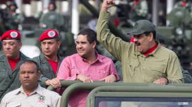 Venezuelan President Nicolas Maduro raises a fist during a military parade in Caracas this year.